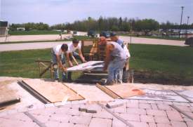 More tiles being positioned.