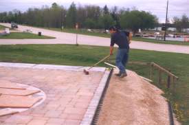 Sweeping in the sand.