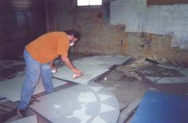 Painting the granite tiles.