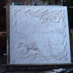 Vertical sundial under construction.